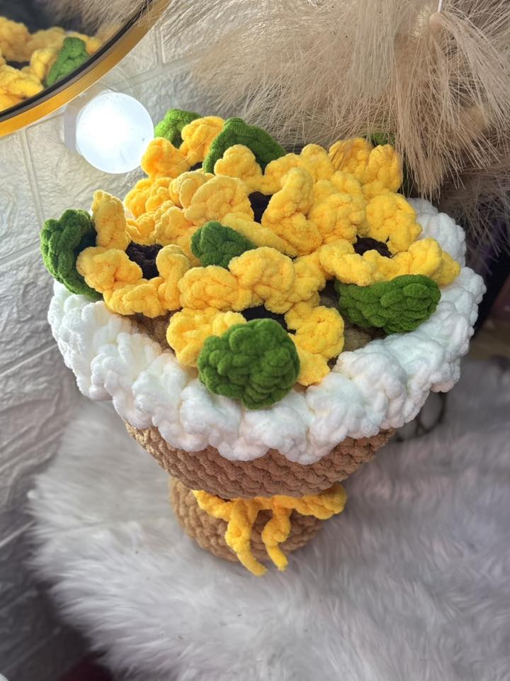 A potted bouquet of crocheted sunflowers